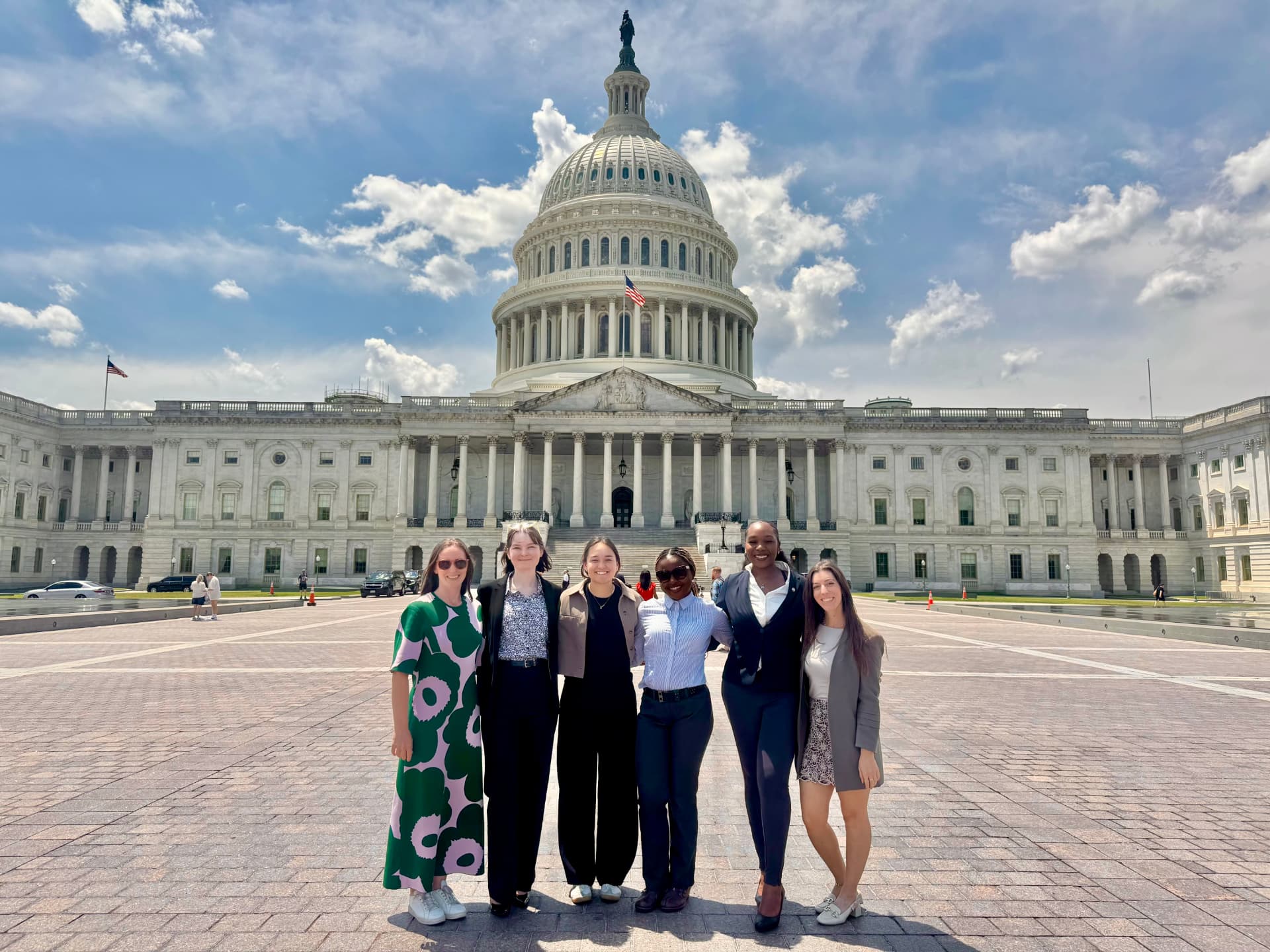 Raine Cox with colleagues in front of the United States Capitol